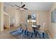 This dining room has a ceiling fan, neutral colors, tile floor and a nice view of the yard at 5537 Misty Woods Dr, Oviedo, FL 32765