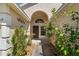 Charming front porch with a detailed door and surrounding greenery creating a welcoming entrance at 5537 Misty Woods Dr, Oviedo, FL 32765
