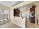 This kitchen has granite countertops, tile floors, stainless steel appliances and dark wood cabinets at 5537 Misty Woods Dr, Oviedo, FL 32765