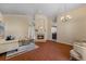 Open living area with hardwood floors, fireplace, and seamless transition to the kitchen and dining spaces at 5537 Misty Woods Dr, Oviedo, FL 32765