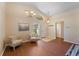 Spacious living room featuring hardwood floors, natural light, and comfortable seating arrangement at 5537 Misty Woods Dr, Oviedo, FL 32765