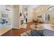 Cozy living room with a fireplace, hardwood floors, and seamless flow to the dining area at 5537 Misty Woods Dr, Oviedo, FL 32765