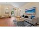 Bright and airy living room featuring hardwood floors, high ceilings, and stylish decor at 5537 Misty Woods Dr, Oviedo, FL 32765