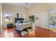 Sunlit main bedroom with ensuite access and sliding glass door to patio at 5537 Misty Woods Dr, Oviedo, FL 32765