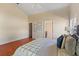 Bright main bedroom with vaulted ceilings, wood floors, and ensuite bathroom at 5537 Misty Woods Dr, Oviedo, FL 32765