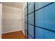 Walk-in closet with built-in shelving and frosted sliding doors at 5537 Misty Woods Dr, Oviedo, FL 32765