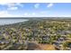 Expansive aerial view featuring a lakeside community with diverse housing options and lush green spaces at 600 Rob Roy Dr, Clermont, FL 34711