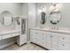 Bright bathroom featuring a double vanity with white cabinets and granite countertops at 600 Rob Roy Dr, Clermont, FL 34711