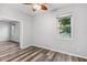 Bedroom featuring wood floors and natural light from the window at 600 Rob Roy Dr, Clermont, FL 34711