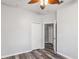 Bedroom featuring wood floors, ceiling fan, and closet at 600 Rob Roy Dr, Clermont, FL 34711
