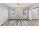 Bedroom showcasing wood floors, windows and sliding barn door at 600 Rob Roy Dr, Clermont, FL 34711