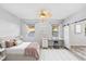 Bright bedroom with wood flooring, barn door access and neutral decor at 600 Rob Roy Dr, Clermont, FL 34711