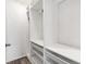 A white walk-in closet with drawers, shelves, and racks at 600 Rob Roy Dr, Clermont, FL 34711