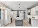 Spacious kitchen featuring an island, stainless appliances, and custom lighting at 600 Rob Roy Dr, Clermont, FL 34711