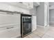 Kitchen with stainless steel wine cooler and custom cabinets at 600 Rob Roy Dr, Clermont, FL 34711