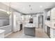 Modern kitchen featuring stainless appliances, a center island, and stylish pendant lighting at 600 Rob Roy Dr, Clermont, FL 34711