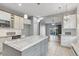 Bright kitchen with island, pendant lights, white cabinetry, and an open layout to the living area at 600 Rob Roy Dr, Clermont, FL 34711