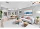 Inviting living room with stylish furnishings, built-in shelving, and an adjacent dining area at 600 Rob Roy Dr, Clermont, FL 34711