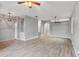 Spacious living room features tile and wood flooring, ceiling fans, and an open layout at 600 Rob Roy Dr, Clermont, FL 34711