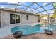Relax in this backyard pool with a screened enclosure, brick pavers, and a lovely patio at 600 Rob Roy Dr, Clermont, FL 34711