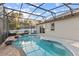 Relax in this backyard pool with a screened enclosure, brick pavers, and a lovely patio at 600 Rob Roy Dr, Clermont, FL 34711