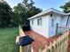 Inviting wood deck perfect for outdoor gatherings or relaxing, complete with a grill at 637 Ash Ave, Daytona Beach, FL 32117