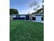 Charming single-story home featuring a well-manicured front lawn and welcoming entrance at 637 Ash Ave, Daytona Beach, FL 32117