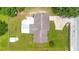 Birds eye view of a well-maintained home with a spacious yard and long driveway at 6426 Sw 60 Ave, Ocala, FL 34474