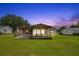 Spacious backyard with a covered patio perfect for outdoor dining and relaxation at 6426 Sw 60 Ave, Ocala, FL 34474