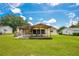 Backyard patio with wooden covering, perfect for outdoor relaxation and entertainment at 6426 Sw 60 Ave, Ocala, FL 34474