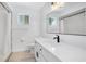 Bright bathroom with a modern vanity, sleek fixtures, and a shower with a curtain at 6426 Sw 60 Ave, Ocala, FL 34474