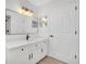 Well-lit bathroom with modern vanity, black hardware, and a large mirror at 6426 Sw 60 Ave, Ocala, FL 34474