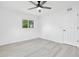 Spacious bedroom features updated flooring, ceiling fan and a double door closet at 6426 Sw 60 Ave, Ocala, FL 34474