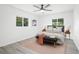 Stylishly furnished bedroom with a grey headboard, neutral bedding, and a soft pink rug at 6426 Sw 60 Ave, Ocala, FL 34474