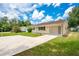 Charming home with a well-maintained front yard, long driveway, and curb appeal at 6426 Sw 60 Ave, Ocala, FL 34474