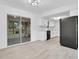 Eat in kitchen featuring stainless steel appliances, white cabinets, and a sliding glass door to the outside patio at 6426 Sw 60 Ave, Ocala, FL 34474