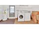 Convenient laundry room with modern washer, dryer, shelving, and water heater at 6426 Sw 60 Ave, Ocala, FL 34474