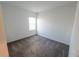 A small empty bedroom with a window allowing natural light at 6442 Pine Warbler Way, St Cloud, FL 34771
