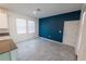 Dining area features a navy accent wall and natural light at 6442 Pine Warbler Way, St Cloud, FL 34771