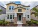 Inviting two-story home with stone accents, landscaped yard, and charming curb appeal at 6442 Pine Warbler Way, St Cloud, FL 34771