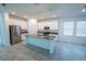 Modern kitchen with stainless steel appliances, sleek countertops, and a central island at 6442 Pine Warbler Way, St Cloud, FL 34771