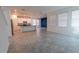 Bright and airy living area with open layout and a view of the modern kitchen at 6442 Pine Warbler Way, St Cloud, FL 34771
