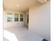 View of a patio area with three windows and an exterior door to the outside at 6442 Pine Warbler Way, St Cloud, FL 34771