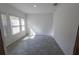 Bright, versatile room with neutral walls and large windows that offer natural light at 6442 Pine Warbler Way, St Cloud, FL 34771