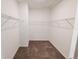 Empty walk-in closet with carpet and wire shelving at 6442 Pine Warbler Way, St Cloud, FL 34771