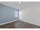 Bright bedroom with gray accent wall, window with blinds, and wood-look herringbone floor at 655 Eagle Pointe South, Kissimmee, FL 34746