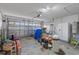 Spacious garage with ample storage space and a functional garage door at 655 Eagle Pointe South, Kissimmee, FL 34746