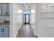 Hallway with decorative front door, arched entryways, and herringbone floors at 655 Eagle Pointe South, Kissimmee, FL 34746