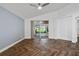 Open living room features vaulted ceilings, ceiling fan, and outdoor view at 655 Eagle Pointe South, Kissimmee, FL 34746