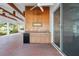Outdoor bar featuring a built-in counter, cabinets, sink, and fridge at 655 Eagle Pointe South, Kissimmee, FL 34746